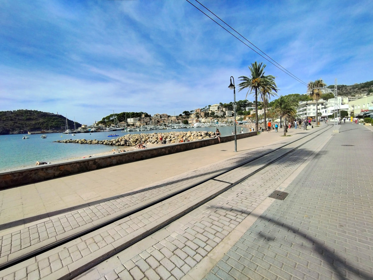 BLEEQUP A coastal promenade features tram tracks embedded in a paved walkway.